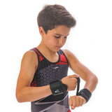 young gymnast with wrist supports